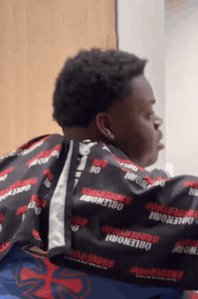 Man Getting Haircut By Barber In Barbershop Cape GIF