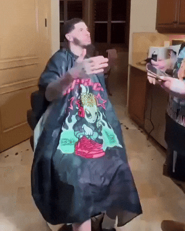 Man Getting Haircut From Skull Cape Barber GIF