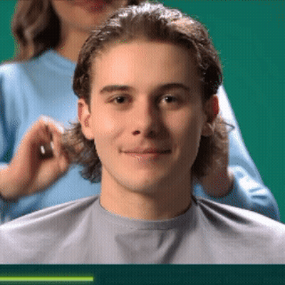 Man Getting Haircut From Woman In Blue Shirt GIF