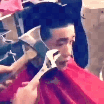 Man Getting Haircut While Wearing Mask GIF