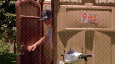 Man Getting Out Of Portable Toilet With Denny's Royal Flush Sign GIF