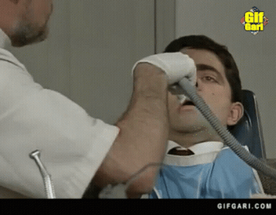 Man Getting Teeth Examined By Dentist GIF