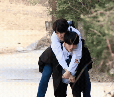 Man Giving Another Man A Piggyback Ride GIF