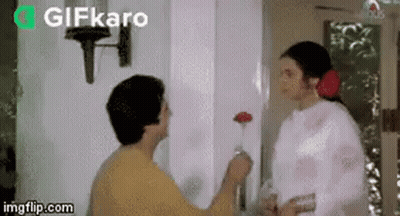 Man Giving Flower To Woman GIF