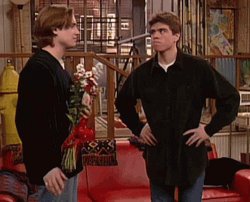 Man Giving Flowers To Bro GIF
