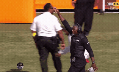 Man Giving High Five In Front Of Fox NFL Bonus Cover GIF