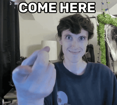 Man Giving Middle Finger In Front Of Come Here Sign GIF