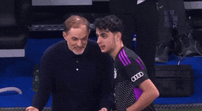 Man Giving Middle Finger To Man In Purple Audi Shirt GIF