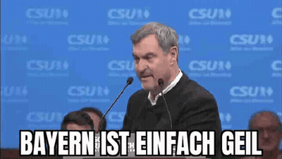 Man Giving Speech At Microphone Says Bayern Ist Einfach Geil GIF