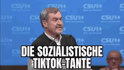 Man Giving Speech At Podium With Microphone GIF
