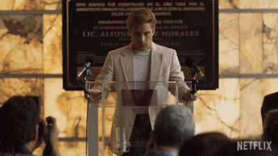 Man Giving Speech At Podium With Netflix Logo GIF