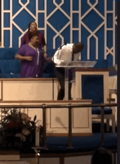 Man Giving Speech At Podium Woman Watching GIF