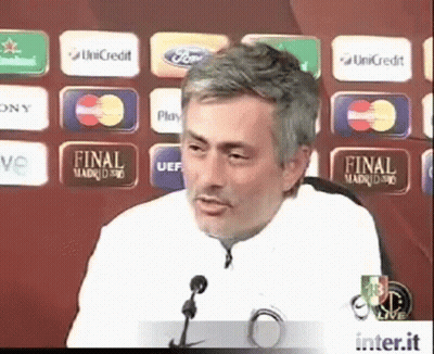 Man Giving Speech In Front Of Final Madrid 90 Sign GIF