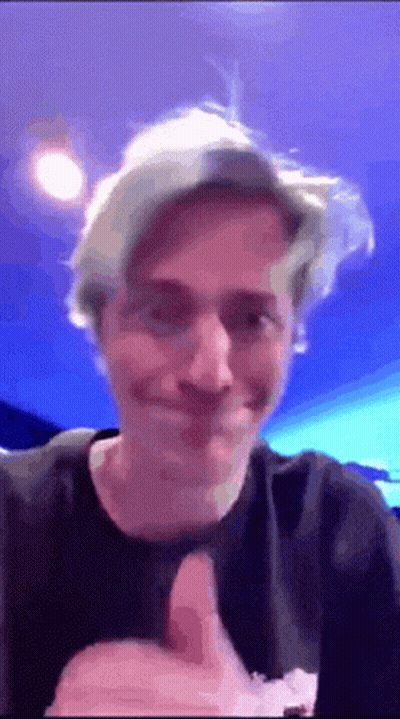 Man Giving Thumbs Up In Front Of Blue Background GIF