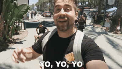 Man Giving Thumbs Up In Front Of Plant Wall GIF