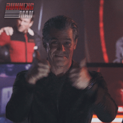 Man Giving Thumbs Up In Front Of Running Man Sign GIF