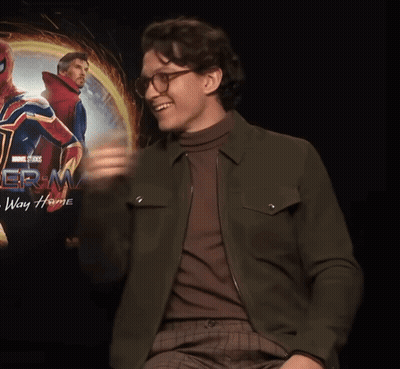 Man Giving Thumbs Up In Front Of Spider-Man Way Home Poster GIF