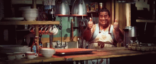 Man Giving Thumbs Up In Kitchen GIF