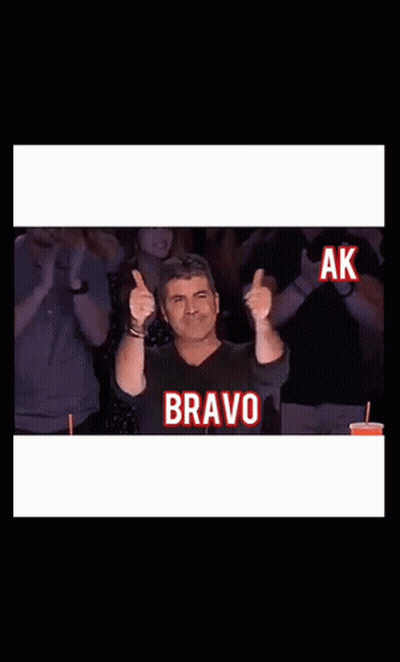Man Giving Thumbs Up With Bravo Screen GIF