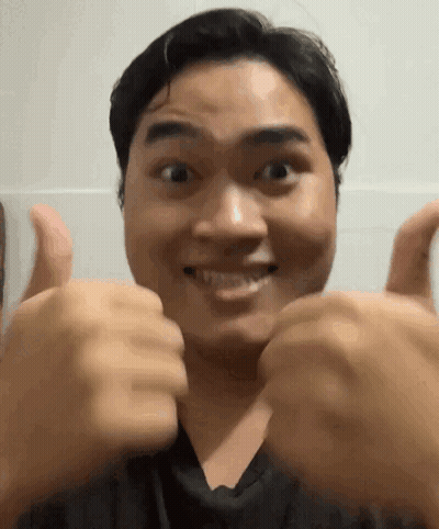 Man Giving Two Thumbs Up And Smiling GIF