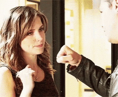 Man Giving Woman Fist Bump GIF