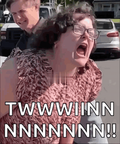 Man Giving Woman Piggyback Ride While She Screams GIF