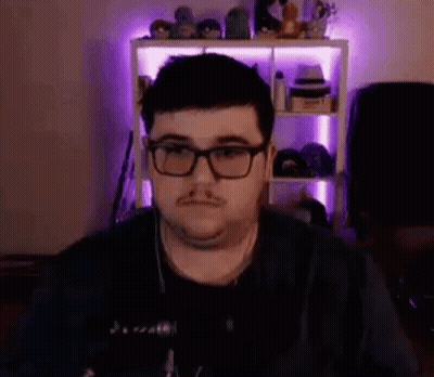 Man Glasses Headphones At Microphone In Purple Lights GIF