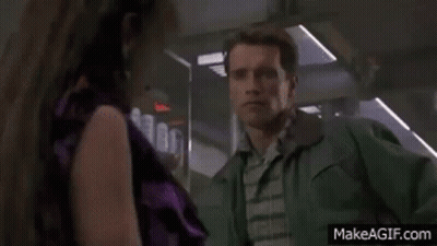 Man Green Jacket Next To Woman Purple Shirt GIF