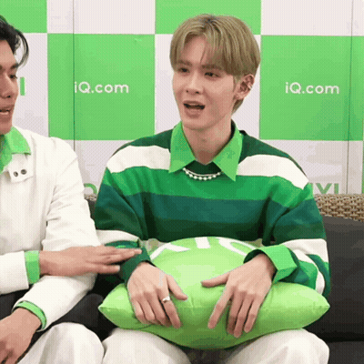 Man Green White Striped Shirt Holding Pillow Iq.com GIF