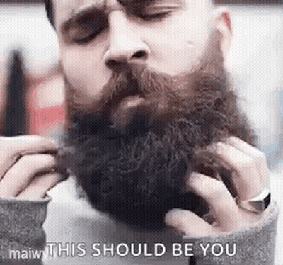 Man Grooming Beard With Comb GIF