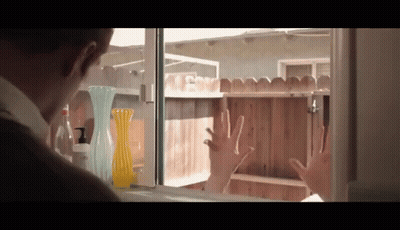 Man Hands On Window Looking At Fence GIF