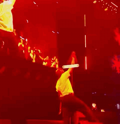 Man Hanging From Rope On Stage GIF