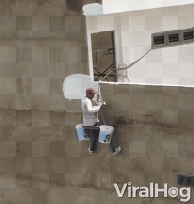 Man Hanging From Rope Painting Wall With Paint Buckets GIF