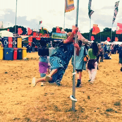 Man Hanging Upside Down Near Recycling Sign GIF