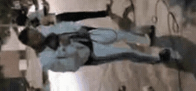 Man Hanging Upside Down With Microphone GIF