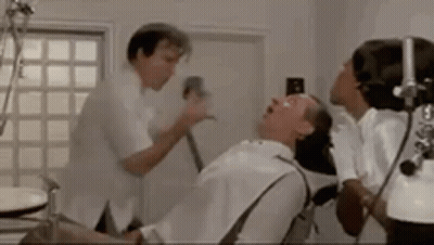 Man Having Dental Exam With Dentist And Nurse GIF