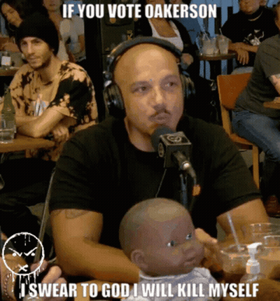 Man Headphones Holding Baby Doll Says If You Vote Oakerson GIF