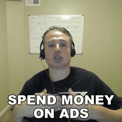 Man Headphones Says Spend Money On Ads Whiteboard GIF