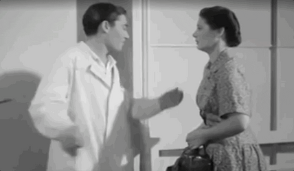 Man Helps Woman To Sit Down GIF