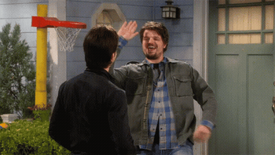 Man High-Fiving Another Man At Basketball Hoop GIF