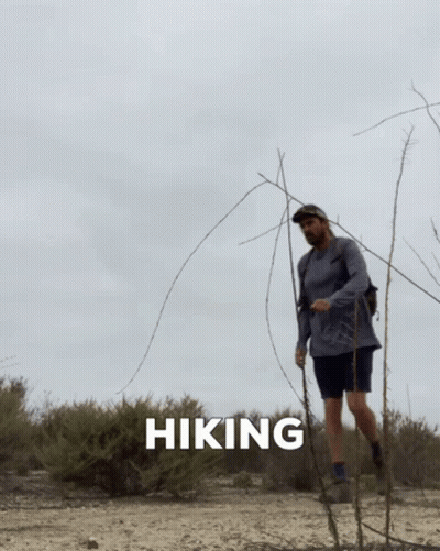 Man Hiking In Desert With Hiking Text GIF