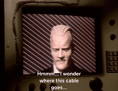 Man Hmm I Wonder Where This Cable Goes GIF