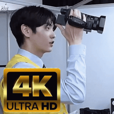 Man Holding 4K Ultra HD Camera GIF