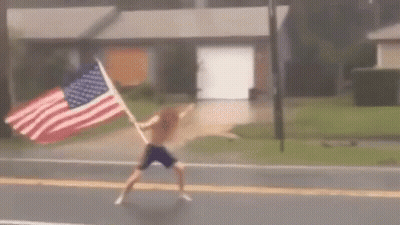 Man Holding American Flag GIF