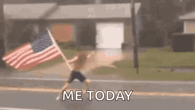 Man Holding American Flag On Roadside GIF