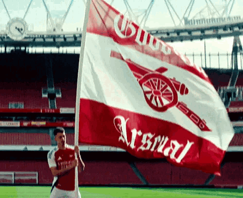 Man Holding Arsenal Flag GIF