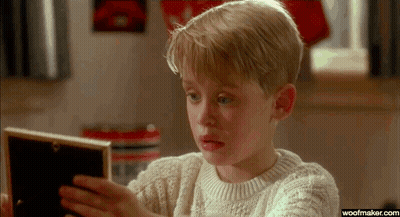 Man Holding Baby In Front Of Mirror GIF