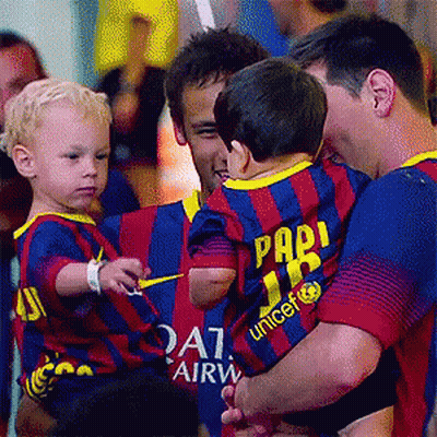Man Holding Baby In Pari Unicef Shirt GIF