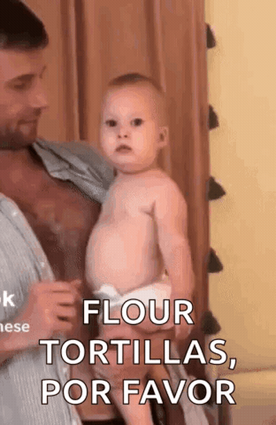 Man Holding Baby Saying Flour Tortillas Por Favor GIF