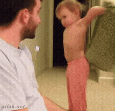 Man Holding Baby Standing In Front Of Mirror GIF